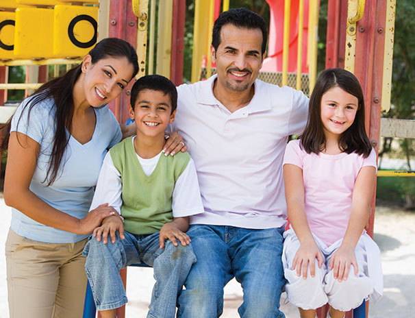 Photo of a family smiling. Link to Life Stage Gift Planner Under Age 45 Situations.